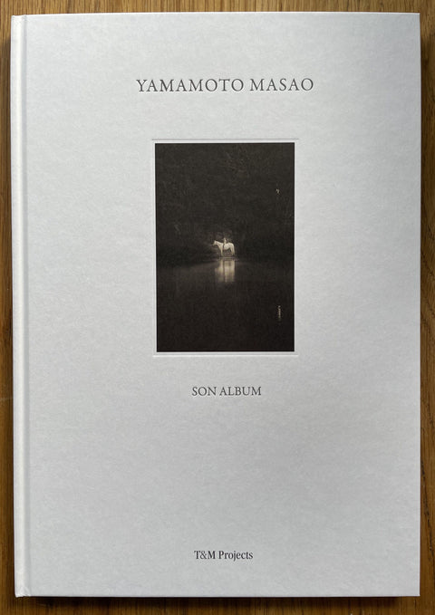 The photobook cover of Son Album by Masao Yamamoto. In hardcover white.
