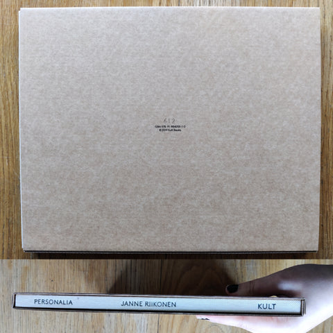 The photography book cover of Personalia by Janne Riikonen. In slipcased harcover beige.