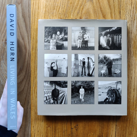 The photography book cover of Living in Wales by David Hurn. In dust jacketed hardcover blue.