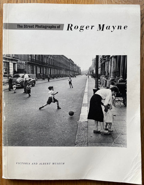 The photography book cover of The Street Photographs of Roger Mayne. In softcover white. Rare.