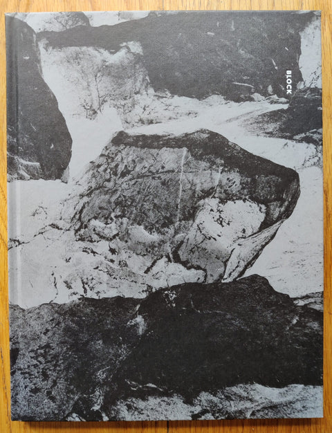 The photography book cover of Block by Aapo Huhta. Hardback with marbled/rocky B&W cover.
