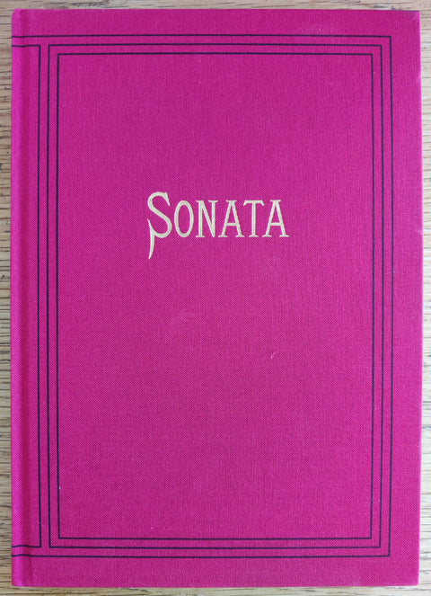 The photography book cover of Sonata by Aaron Schuman. In hardcover red. Signed