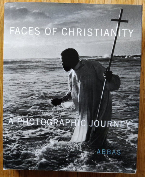 The photography book cover of Faces of Christianity: A Photographic Journey by Abbas. In dust jacketed hardcover white.