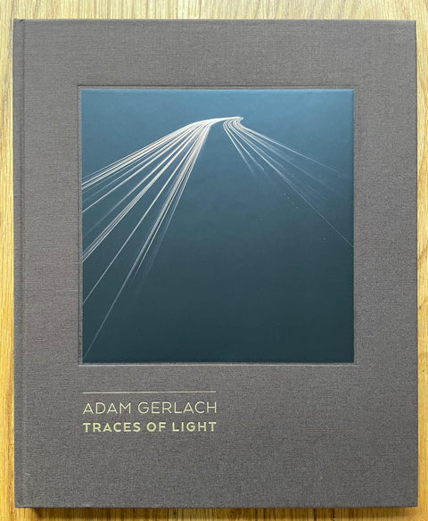 The photography book cover of Traces of Light by Adam Gerlach. Hardback in grey. Signed.