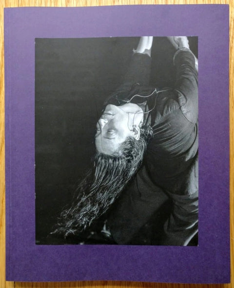 The photography book cover of Dyckman Haze by Adam Pape. Paperback with purple border.