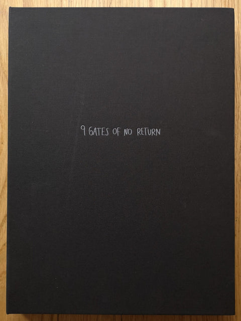 The photography book cover of 9 Gates of No Return by Agata Grzybowska. Hardback in black with centred white title.