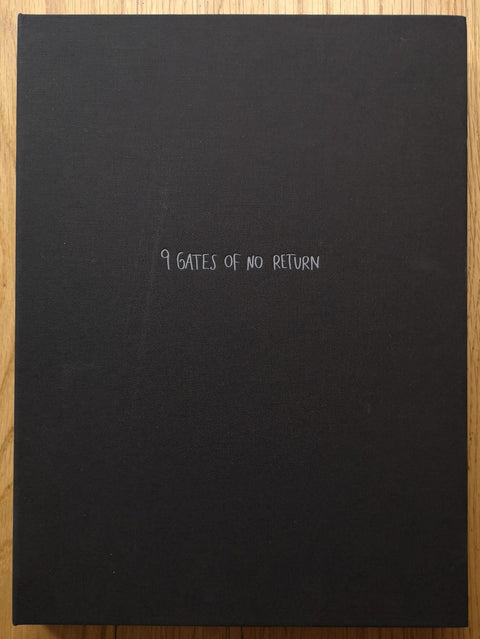 The photography book cover of 9 Gates of No Return by Agata Grzybowska. Hardback in black with centred white title.
