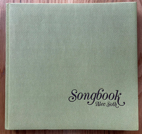 The photography book cover of Songbook by Alec Soth. Hardback in light green.