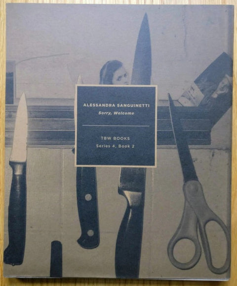 The photography book cover of Sorry Welcome by Alessandra Sanguinetti. Hardback with knives on the cover.