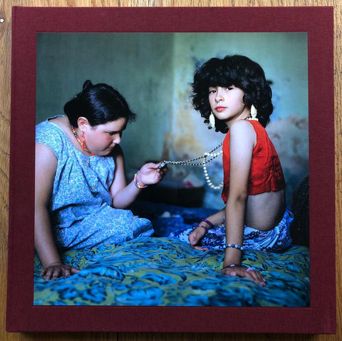 The photography book cover of The Adventure of Guille and Belinda and the Enigmatic Meaning of their Dreams by Alessandra Sanguinetti. Hardback in dark red. Signed.