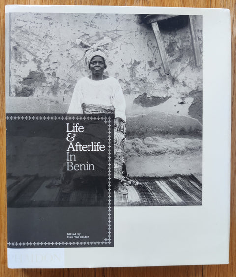 The photgraphy book cover of Life & Afterlife in Benin edited by Alex Van Gelder. In dust jacketed hardcover black.