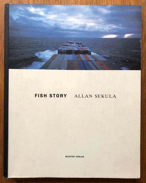 The photography book cover of Fish Story by Allan Sekula. Paperback with photo of the ocean at the top.