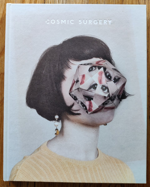 The phootbook cover of Cosmic Surgery by Alma Haser. In hardcover. Signed by Alma Haser.