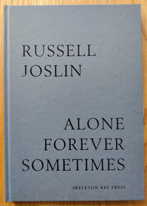 The photography book cover of Alone Forever Sometimes by Russel Joslin. Hardback in grey. Signed.