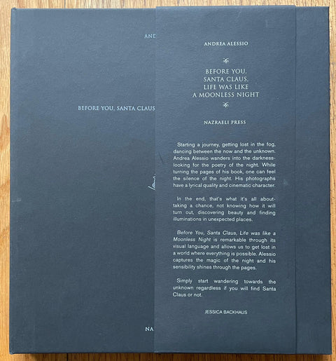 The photography book cover of Before You, Santa Claus, Life was like a Moonless Night by Andrea Alessio. Hardback in navy blue. Signed.