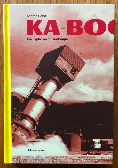 The photography book cover of Ka-Boom by Andrea Botto. Hardback red hue black and white photo with yellow spine.