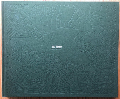 The photography book cover of The Heath by Andy Sewell. Hardback dark green cover with complex line pattern engraved over the cover.