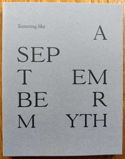 The photography book cover of Teetering like a September myth by Angus Scott. In softcover grey. Signed to title page.