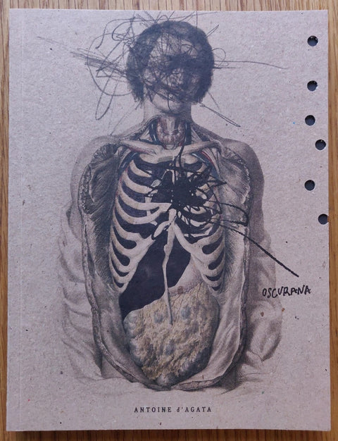 The photography book cover of Oscurana by Antoine d'Agata. Paperback with image of an opened body revealing the skeleton.