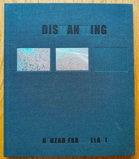 The photography book cover of Dismantling by Behzad Farazollahi. Hardback in blue.