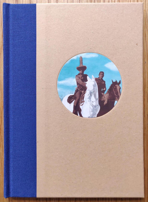 The photography book cover of Lone Ranger by Betty Hahn. Hardback with image of two men on horses in the middle circle. Blue binding.