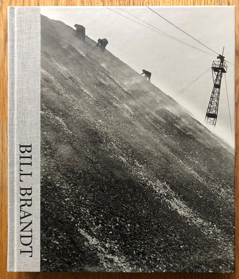 The photography book cover of Bill Brandt. Hardback in grey.