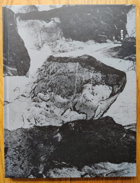 The photography book cover of Block by Aapo Huhta. Hardback with marbled/rocky B&W cover.