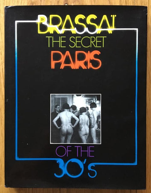 The photography book cover of The Secret Paris of the 30's by Brassai. In dust jacketed hardcover. Signed by Brassai.