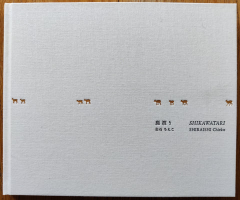 The photobook cover of Shikawatari by Chieko Shiraishi. In hardcover white. signed.
