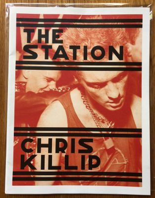 The photography book cover of The Station by Chris Killip. Loose leave newspaper style with red cover.