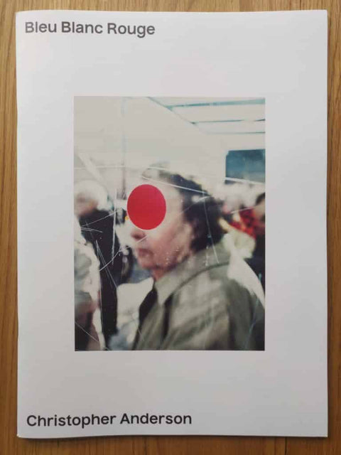 Bleu Blanc Rouge by Christopher Anderson. Paperback in white with photo of person with red circle over their eyes.