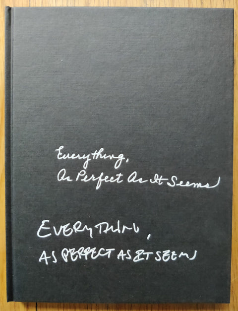 The photography book cover of Everything, As Perfect As It Seems by Christopher E. Manning. Hardback in black.