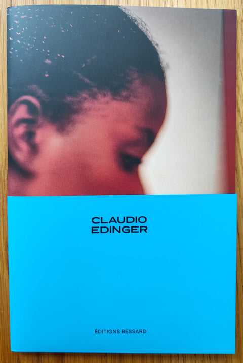 The photography book cover of From Good to Jesus to Miracles by Claudio Edinger. Paperback, bottom half of the cover block blue colour. Signed.