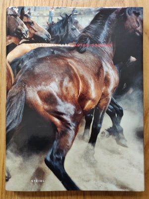 The photography book cover of Autobiography by Cristobal Hara. Hardback with cover photo of horses.