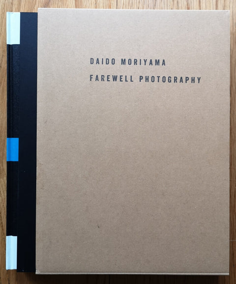 The photography book cover of Farewell Photography by Daido Moriyama. Hardback with slipcase cover in brown. Signed.