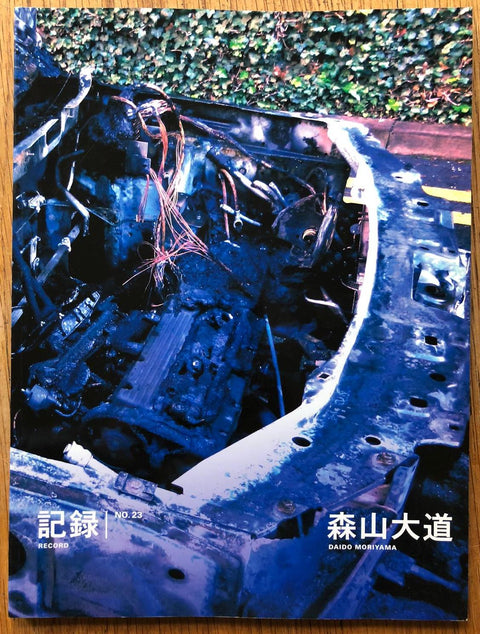 The photography book cover of Record NO.23 by Daido Moriyama. Paperback in blue and green. Signed.