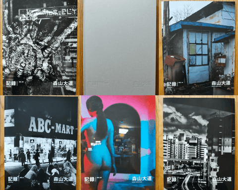 The photography book covers of Daido Moriyama's Record. Large format paperbacks. Signed.