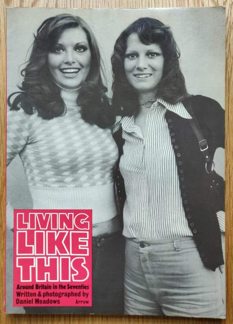 The photography book cover of Living Like This by Daniel Meadows. Paperback with B&W image of two women on the cover.
