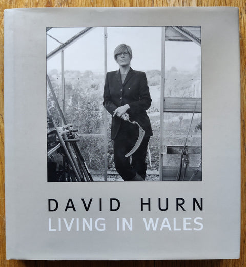 The photography book cover of Living in Wales by David Hurn. In dust jacketed hardcover blue.