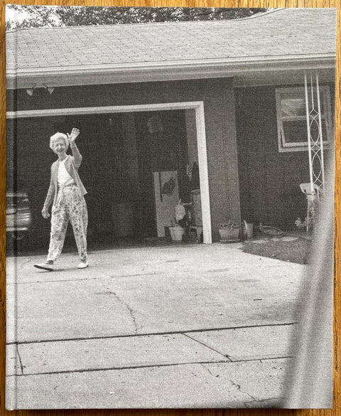 The photobook cover of Leaving and Waving by Deanna Dikeman. In hardcover black and white.