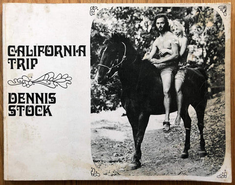 The photography book cover of California Trip by Dennis Stock. Paperback b&w cover image of a man and woman on a horse.