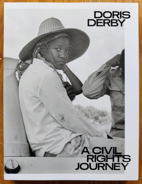 The photobook cover of A Civil Rights Journey by Doris Derby. In softcover white.