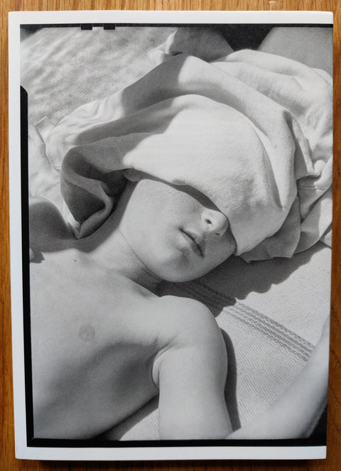 The photobook cover of Day Sleeper by Dorothea Lange, edited by Sam Contis. In softcover white.