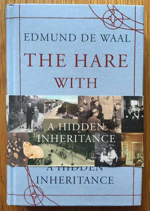 The book cover of The Hare With The Amber Eyes by Edmund De Waal. In hardcover light blue.