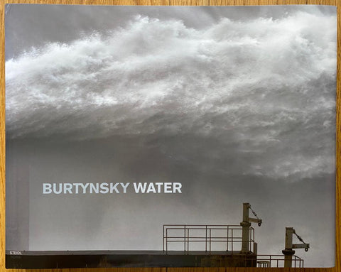 The photography book cover of Burtynsky: Water  by Edward Burtynsky. Hardback with large water spray on the cover.