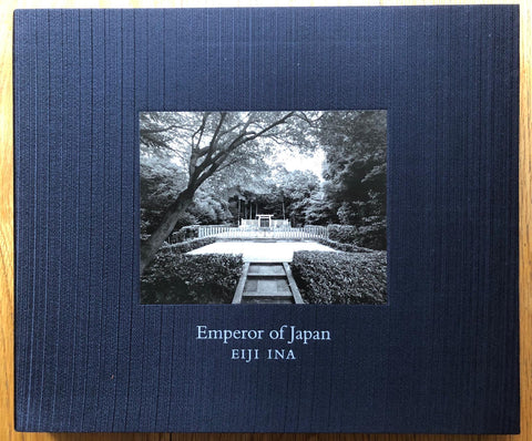 The photography book cover of Emperor of Japan by Eiji Ina. Hardback in dark blue. Signed.