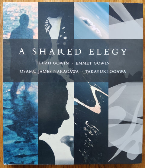 The photography book cover of A Shared Elegy by Elijah Gowin | Emmet Gowin | Osamu James Nakawaga | Takayuki Ogawa. In dust jacketed hardcover grey.