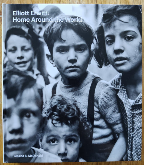 The photobook cover of Elliott Erwitt: Home Around The World. In hardcover with children.