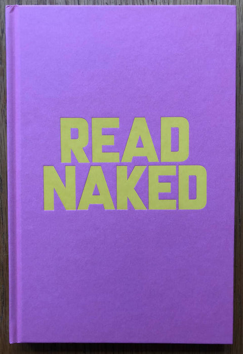 The photobook cover of Read Naked by Erik Kessels. Hardback in purple with large yellow title.