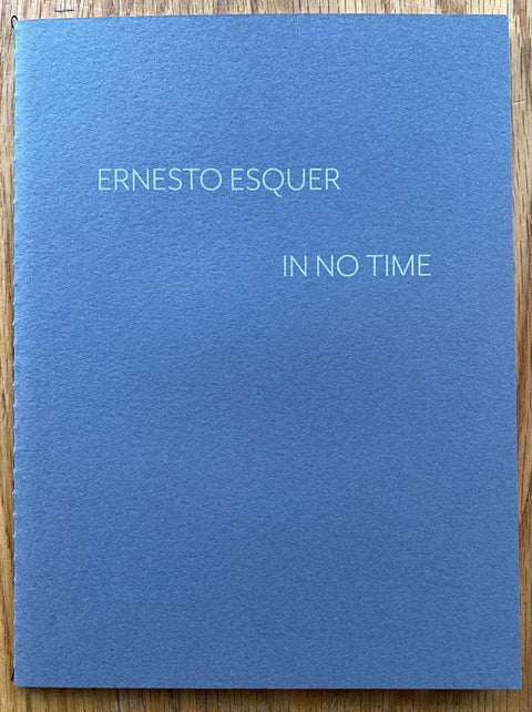 The photography book cover of In No Time by Ernesto Esquer. Paperback in blue. Signed.